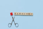 the word vasectomy made with wooden tiles on a blue background